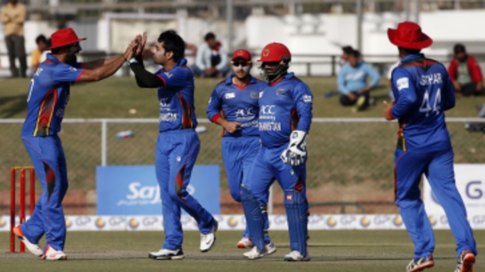 Rashid Khan celebrates a wicket with his team-mates