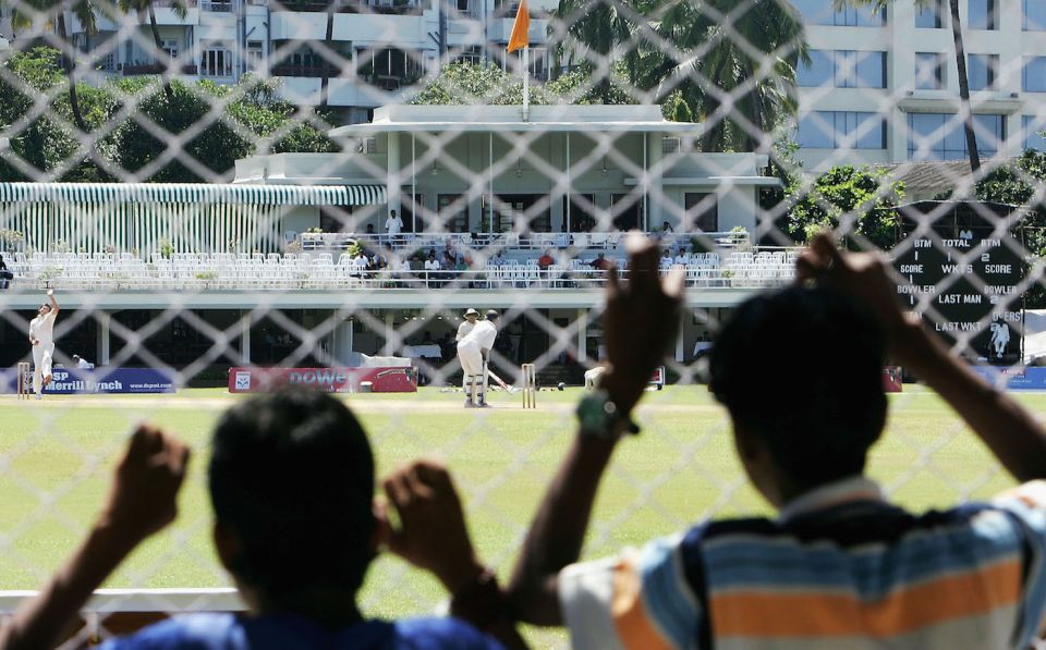 Kids peer into the Brabourne Stadium, where the pavillion sits right at the boundary's edge