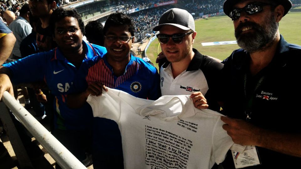 The Gang members present one of their T-shirts to the Barmy Army