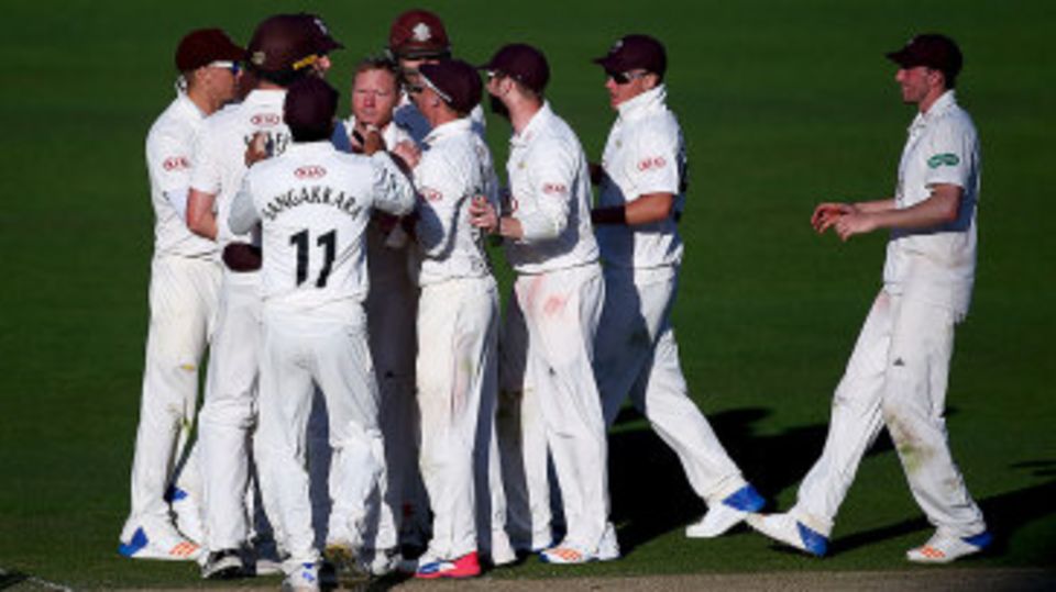 Gareth Batty and the Surrey team celebrate another wicket