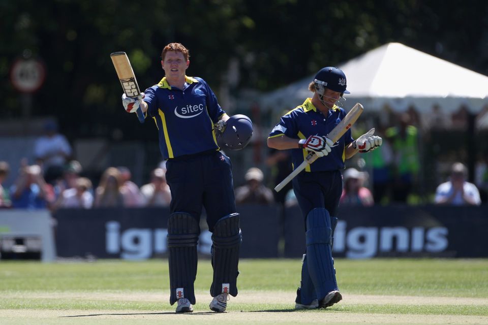 A penchant for clobbering 'em: Kevin O'Brien raises his bat after a 44-ball hundred