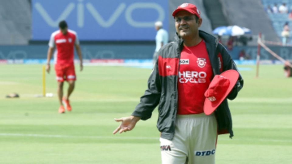 Kings XI Punjab's director of cricket operations, Virender Sehwag, reacts in the field