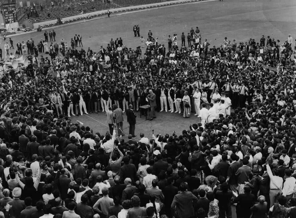 The crowd gathers around for the presentation at the end of the match