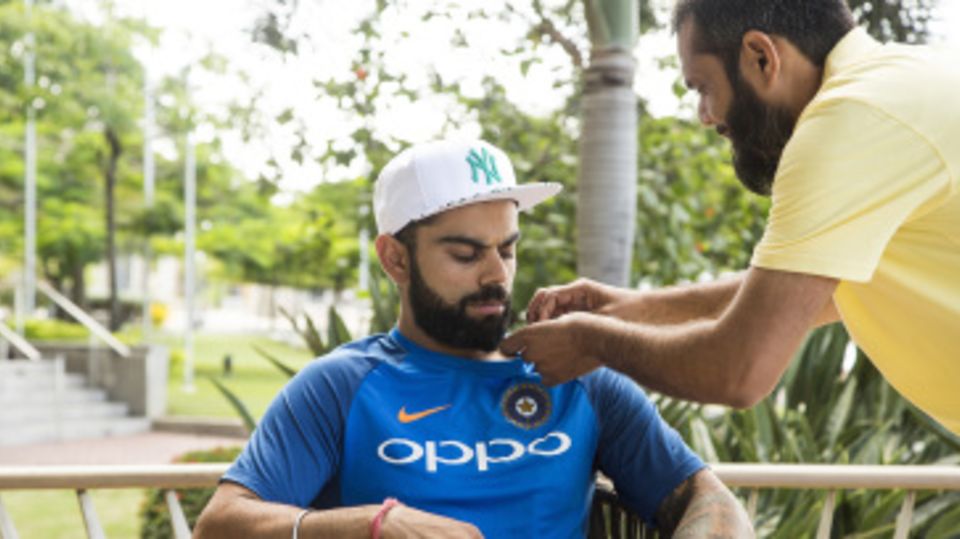 Virat Kohli has a mic attached to his shirt