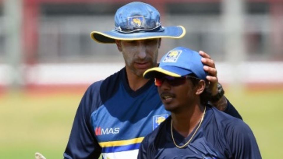 Nic Pothas, Sri Lanka's interim coach, with Lakshan Sandakan during a training session