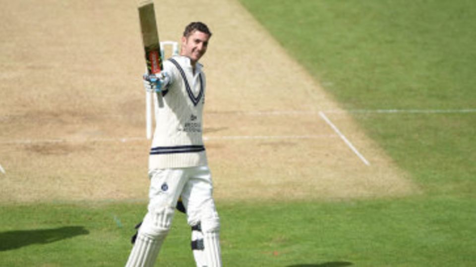 Stevie Eskinazi celebrates his hundred