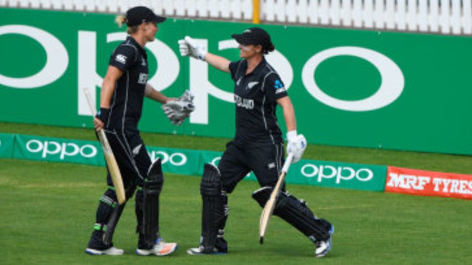 Sophie Devine is congratulated by Katey Martin as she walks off the park