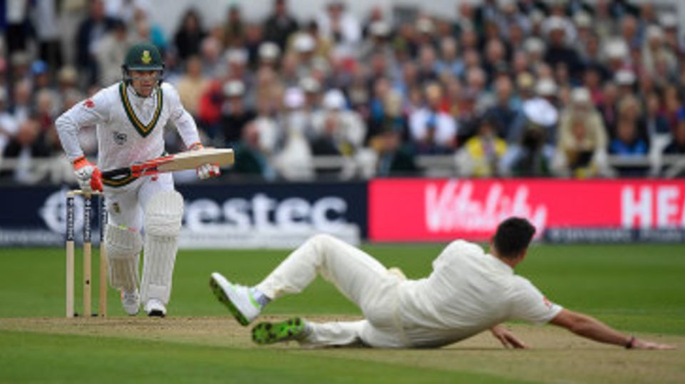 Heino Kuhn drives back past James Anderson