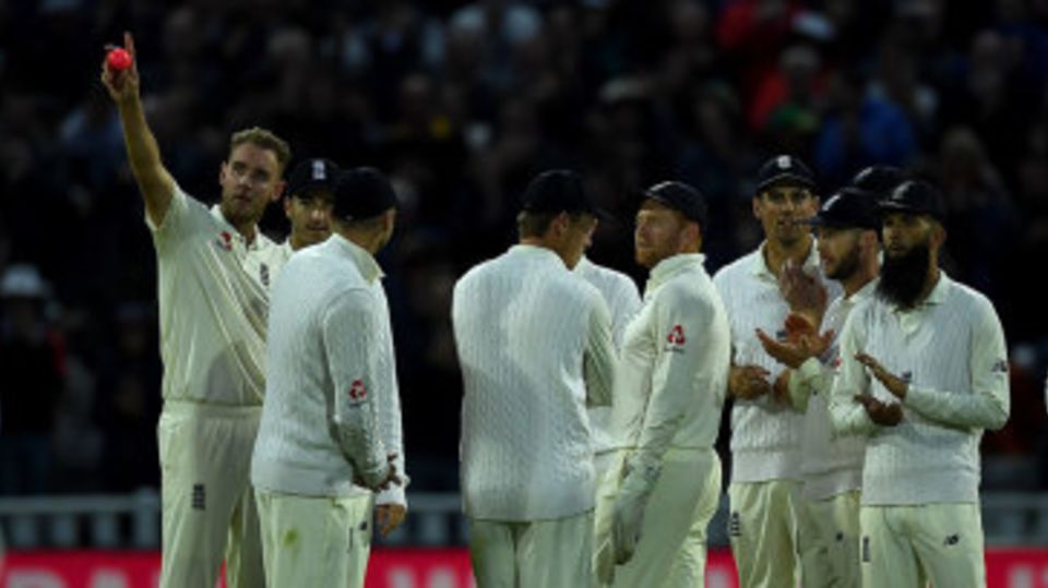 Stuart Broad acknowledges the ovation as he passes Ian Botham