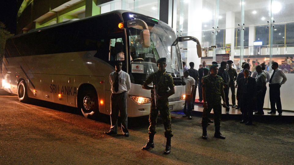 Sri Lankan Special Task Force soldiers guard the Sri Lankan team bus