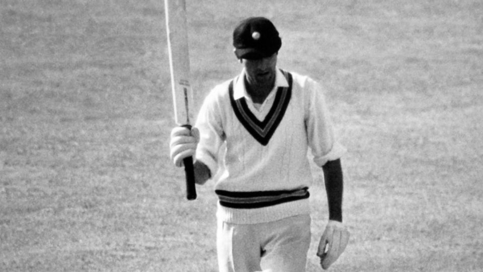 The Nawab of Pataudi raises his bat after reaching his century