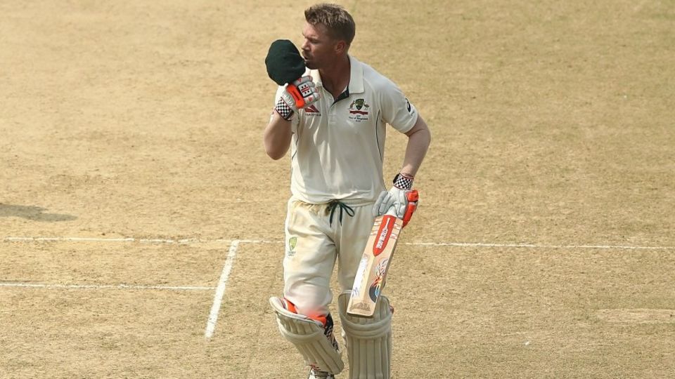 David Warner celebrates the slowest hundred of his Test career