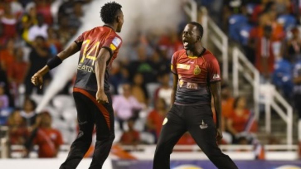 Kevon Cooper and Ronsford Beaton celebrate a Patriots wicket