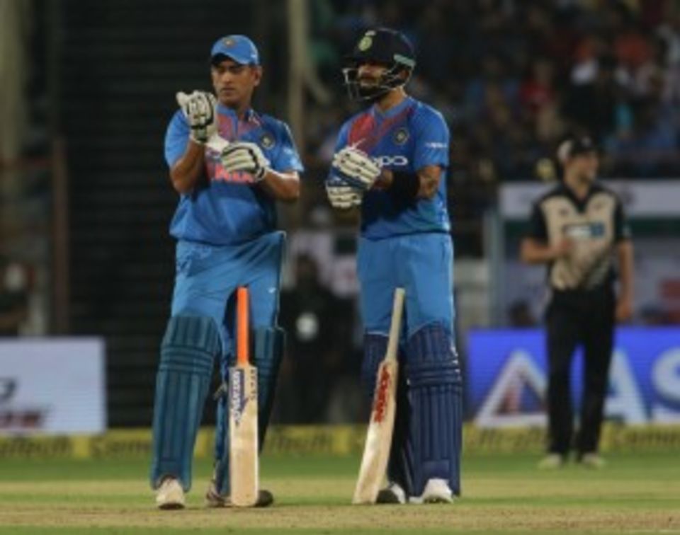 MS Dhoni and Virat Kohli in silent contemplation of the increasing asking rate