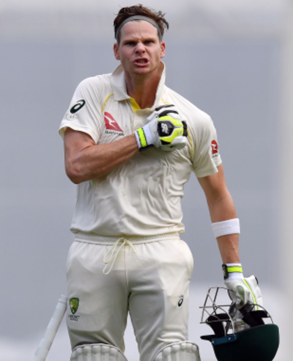 Steven Smith thumps the Australia badge on his shirt after bringing up his century
