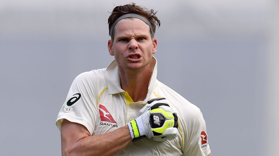 Steven Smith thumps the Australia badge on his shirt after bringing up his century
