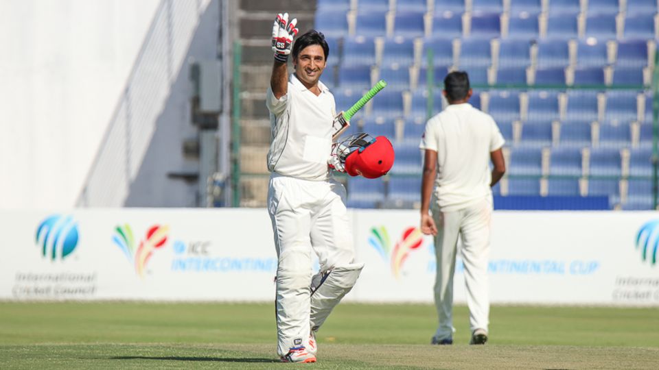 Asghar Stanikzai holds up four fingers after scoring his fourth century of the current Intercontinental Cup competition