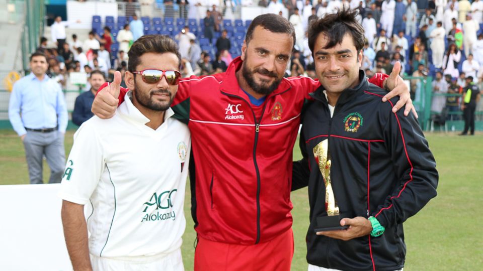 Rais Ahmadzai has donned various hats. Here, as coach, he poses with Zahir Khan and Rashid Khan after Afghanistan won the 2015-17 Intercontinental Cup