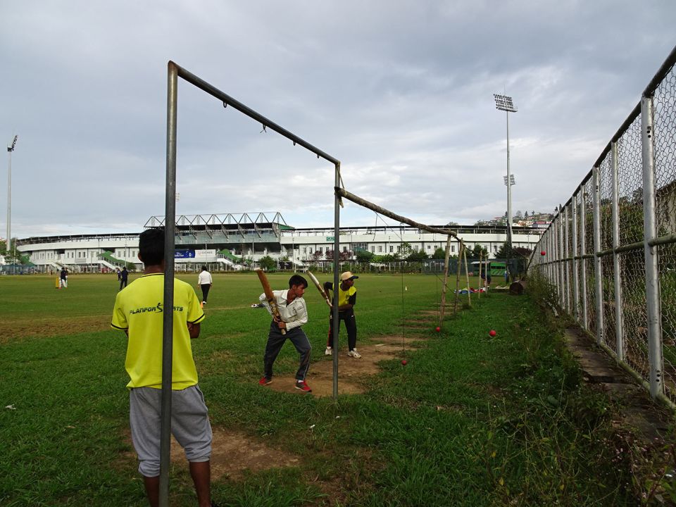 A couple of batsmen polish their high-elbow technique at the sports complex