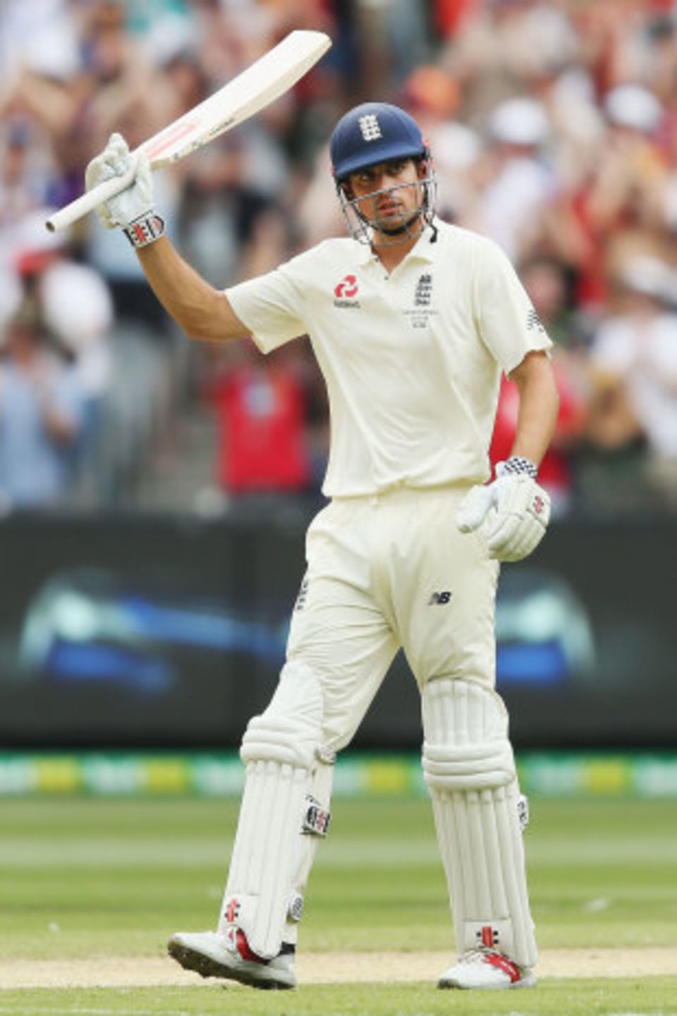 Alastair Cook raises his bat for 150