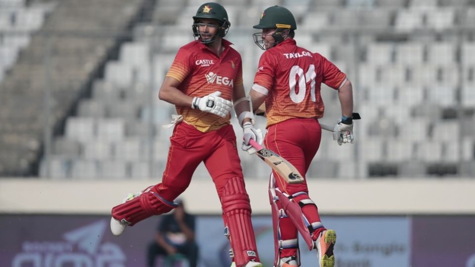 Brendan Taylor and Graeme Cremer run between the wickets