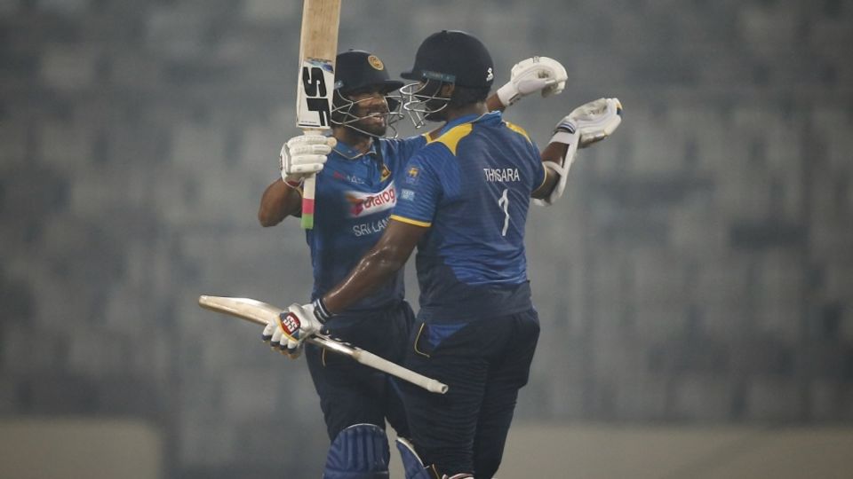 Dinesh Chandimal celebrates Sri Lanka's win with Thisara Perera