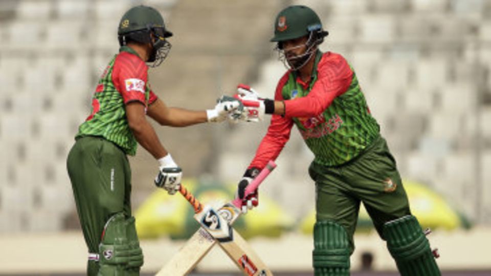 Tamim Iqbal and Shakib Al Hasan bump fists during their partnership