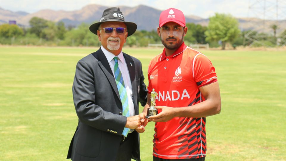 Nikhil Dutta accepts the Man of the Match award from ICC match referee Dev Govindjee