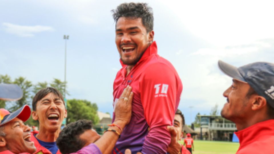 Karan KC is hoisted into the air by his team-mates after rallying Nepal to a miracle win