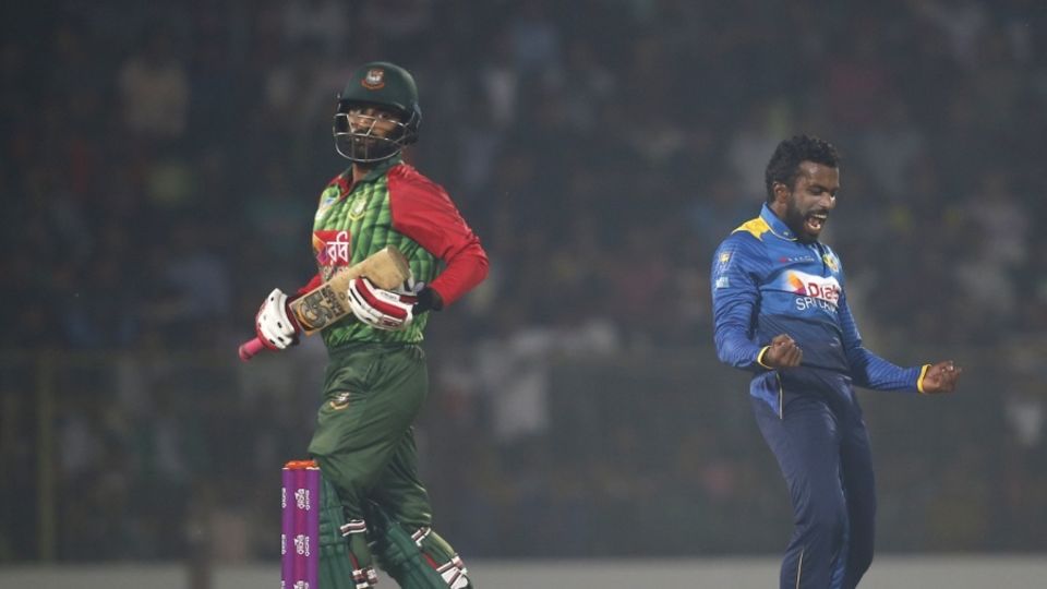Amila Aponso celebrates the wicket of Tamim Iqbal