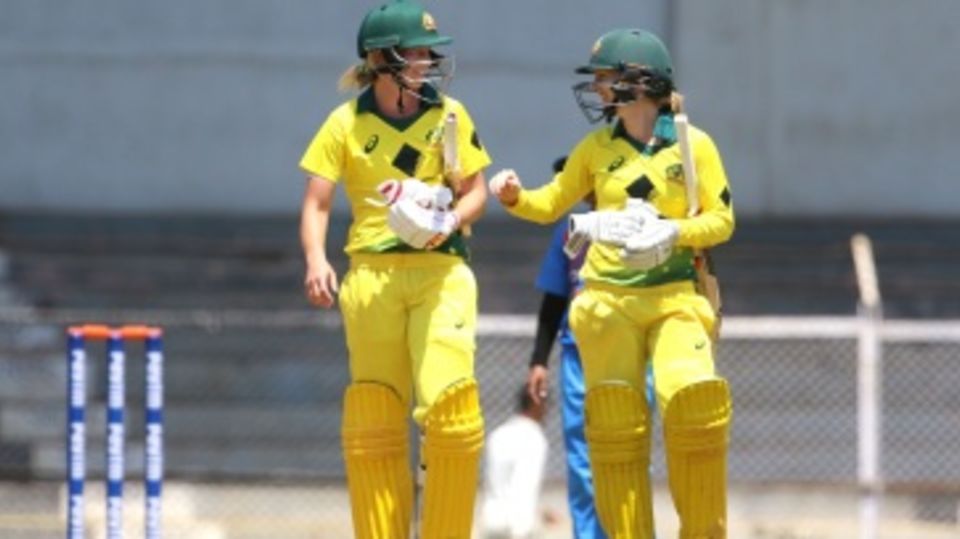 Meg Lanning and Rachel Haynes walk back after Australia's win