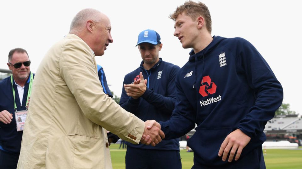 Vic Marks hands fellow Somerset spinner Dom Bess his cap