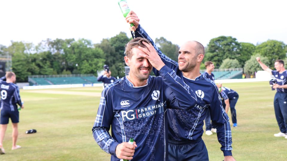 Kyle Coetzer gives Calum MacLeod a well-deserved victory shower after the win over England in 2018