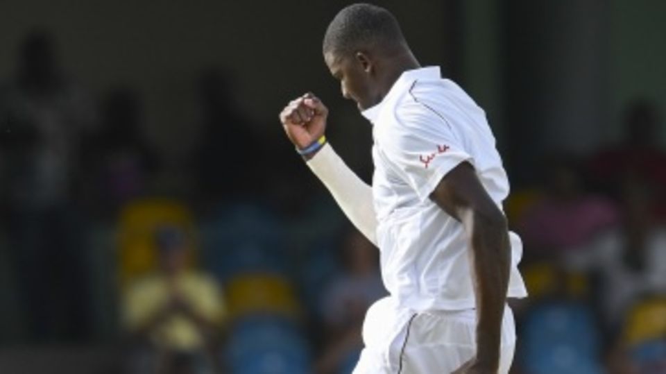 Jason Holder celebrates one of his four wickets