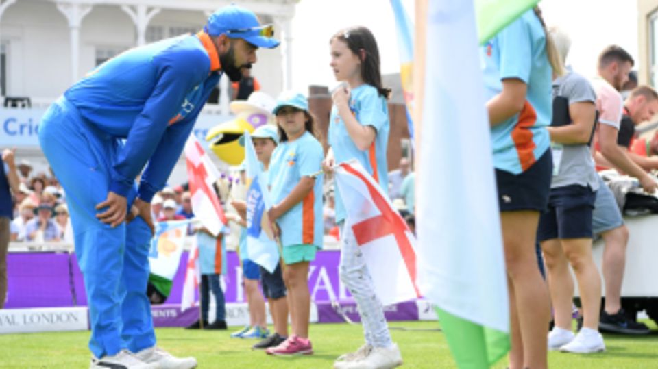 Virat Kohli has a chat with one of the All Stars Cricket participants