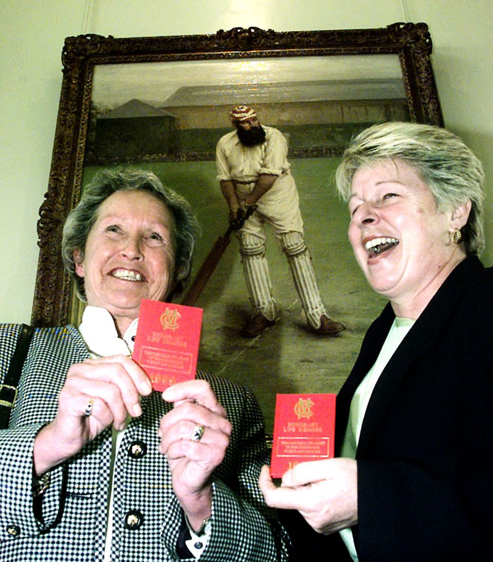 Former England players Rachael Heyhoe-Flint (left) and Jacqueline Court hold up their MCC membership books in 1999