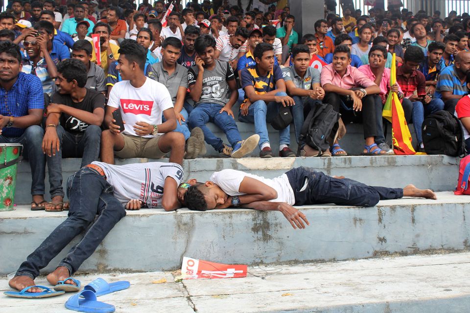 The raucous, festive atmosphere at the Premadasa gets all too much for a couple of spectators