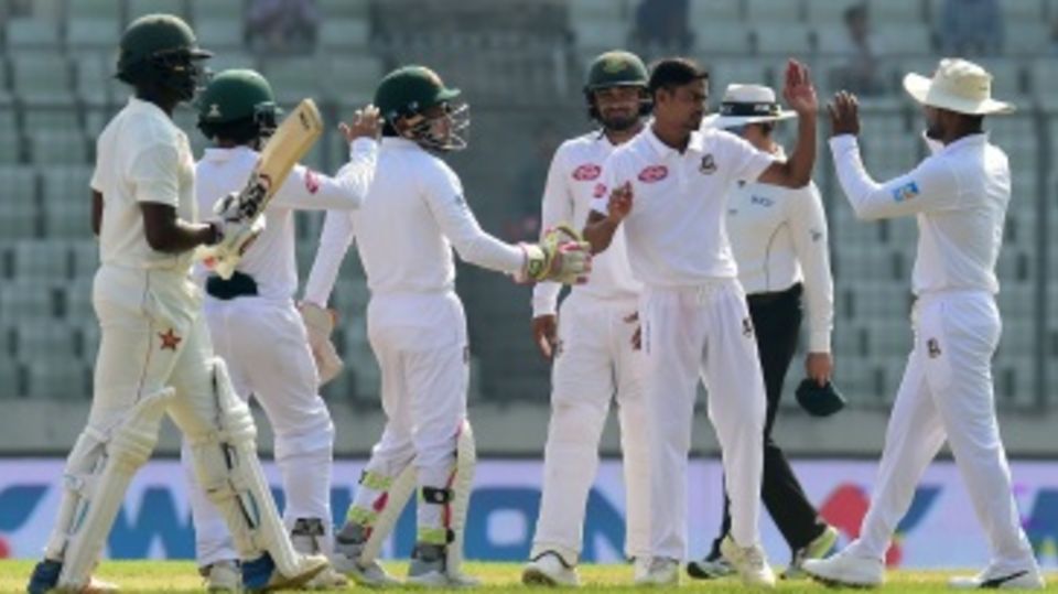 Taijul Islam celebrates a wicket with team-mates