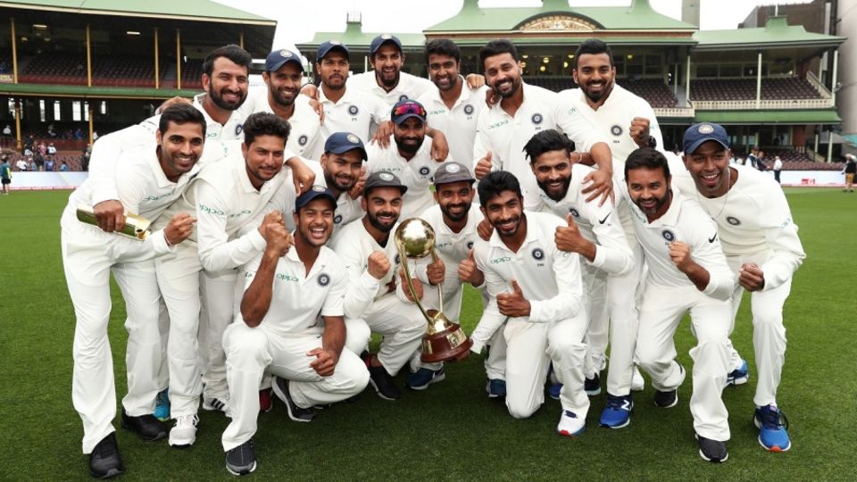 The Indian players pose with the Border-Gavaskar Trophy