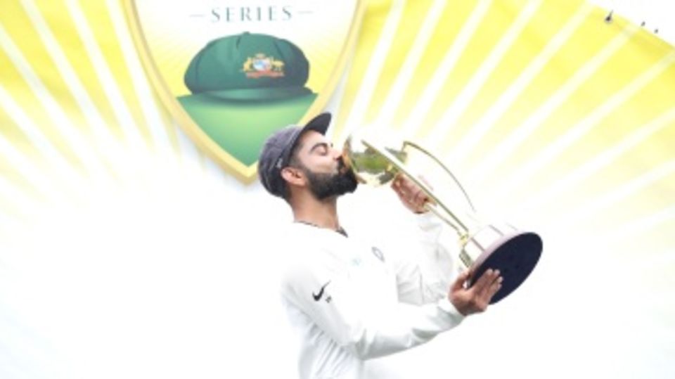 Virat Kohli kisses the Border-Gavaskar Trophy