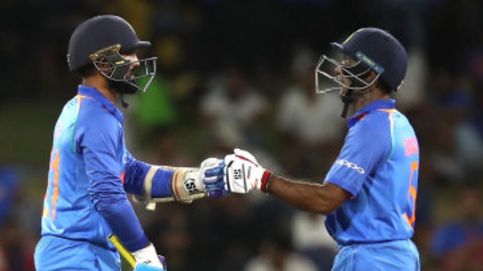 Dinesh Karthik (left) and Ambati Rayudu bump fists during their partnership
