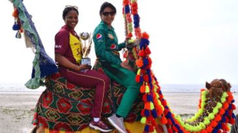 Merissa Aguilleira and Bismah Maroof pose with the T20I trophy