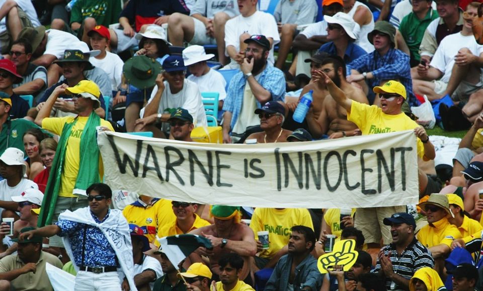 The crowd at Australia's opening game of the 2003 World Cup show their support for Warne