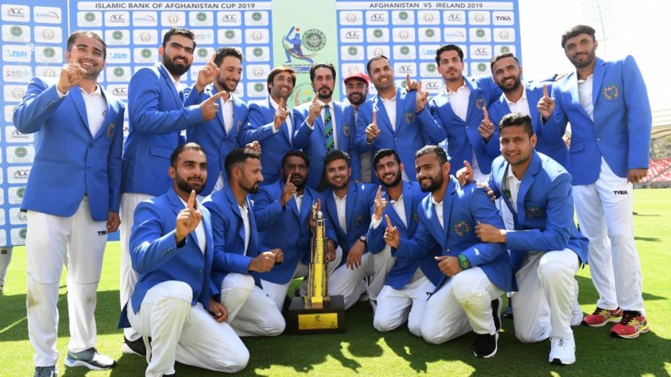 The first one - the Afghanistan players celebrate their maiden Test win