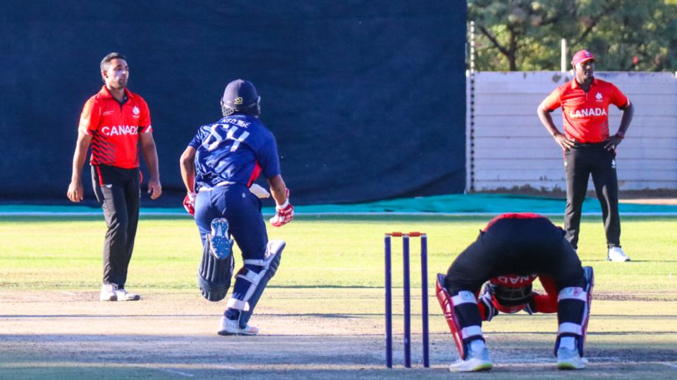 Wicketkeeper Srimantha Wijeyeratne looks down in agony as tailender Nosthush Kenjige's final-over boundary dropped Canada below PNG on net run rate tiebreaker