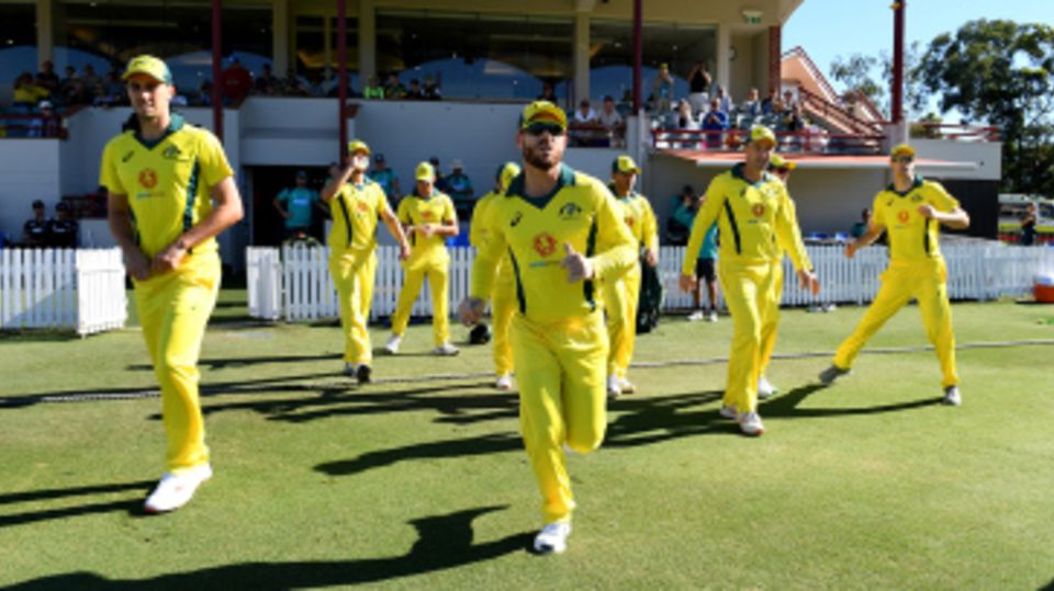 David Warner takes the field