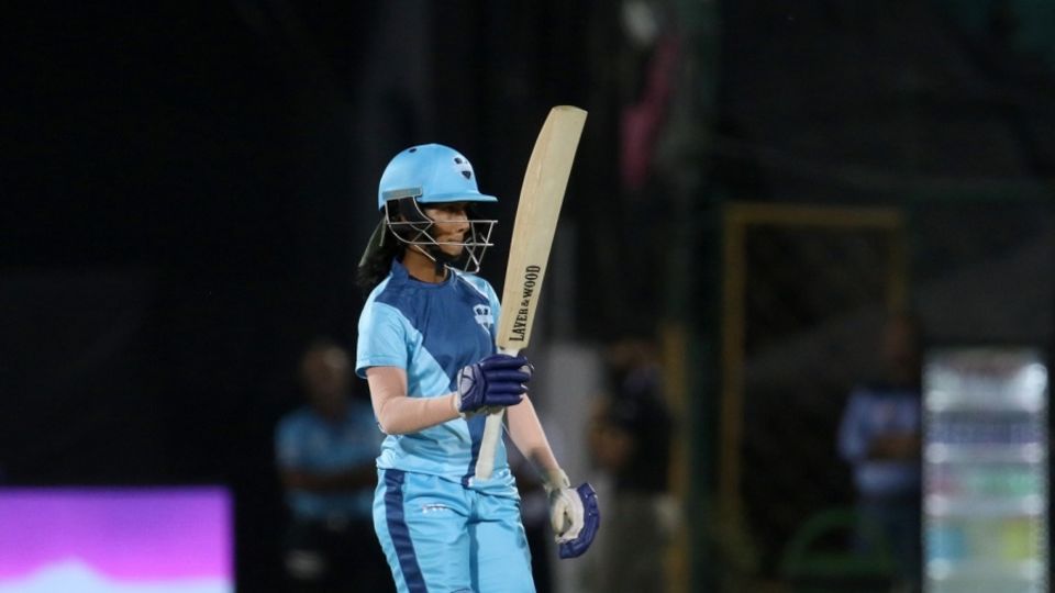 Jemimah Rodrigues raises her bat after getting to fifty