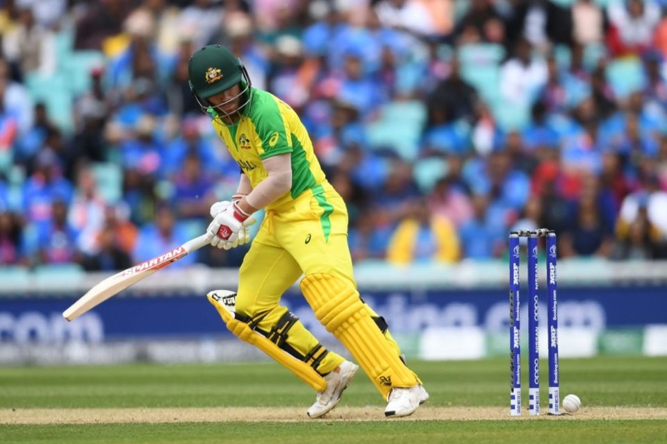 David Warner looks on as the ball hits the stumps but fails to dislodge the bails