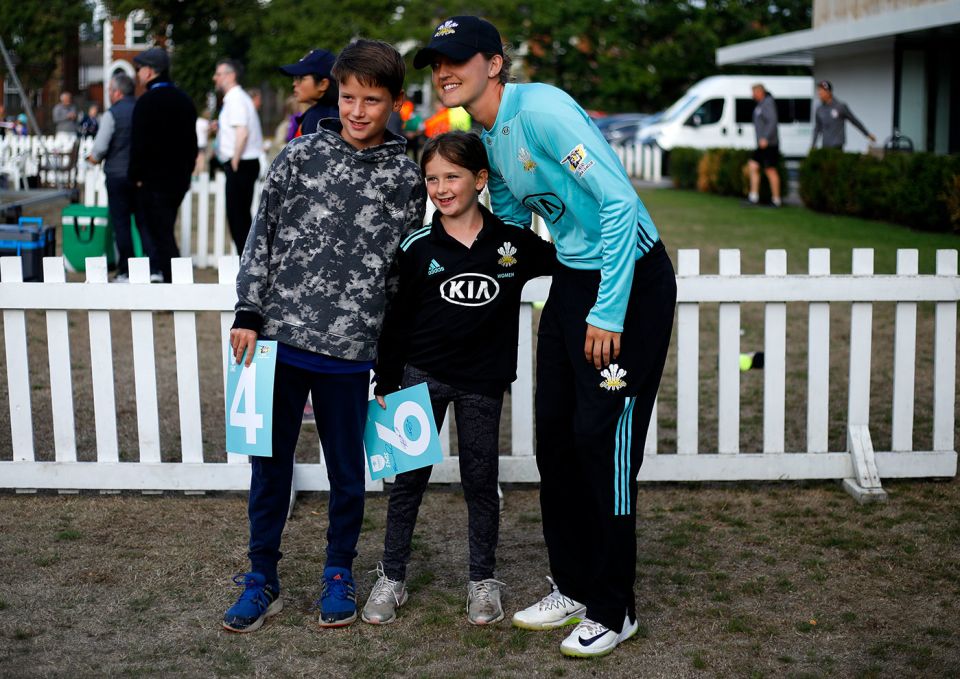 Taylor poses with young fans during a Kia Super League game