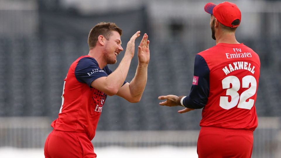 James Faulkner and Glenn Maxwell celebrate a wicket